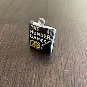 The Hunger Games Inspired Book Cover polymer clay art charm. One size.
